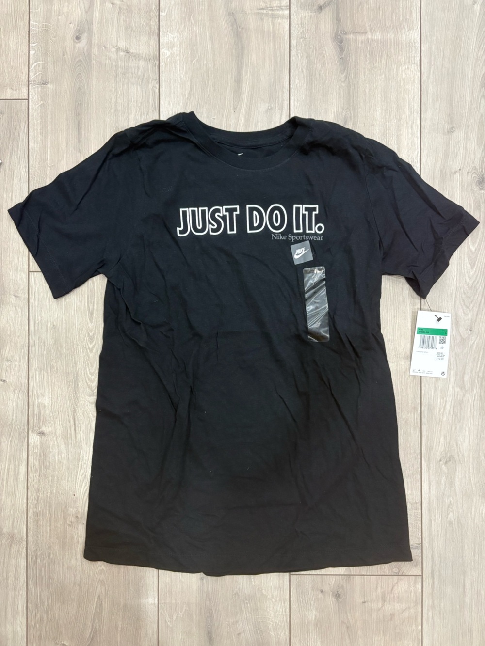 Nike Kid's XL Black Short Sleeve Tee with White 'JUST DO IT.' Vertical Logo.